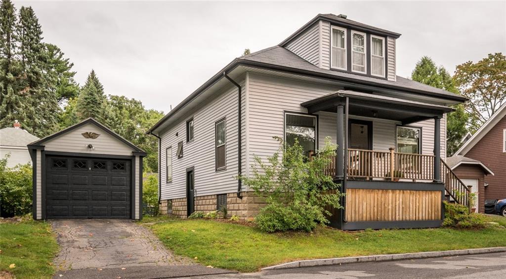Front of house showing one car garage.
