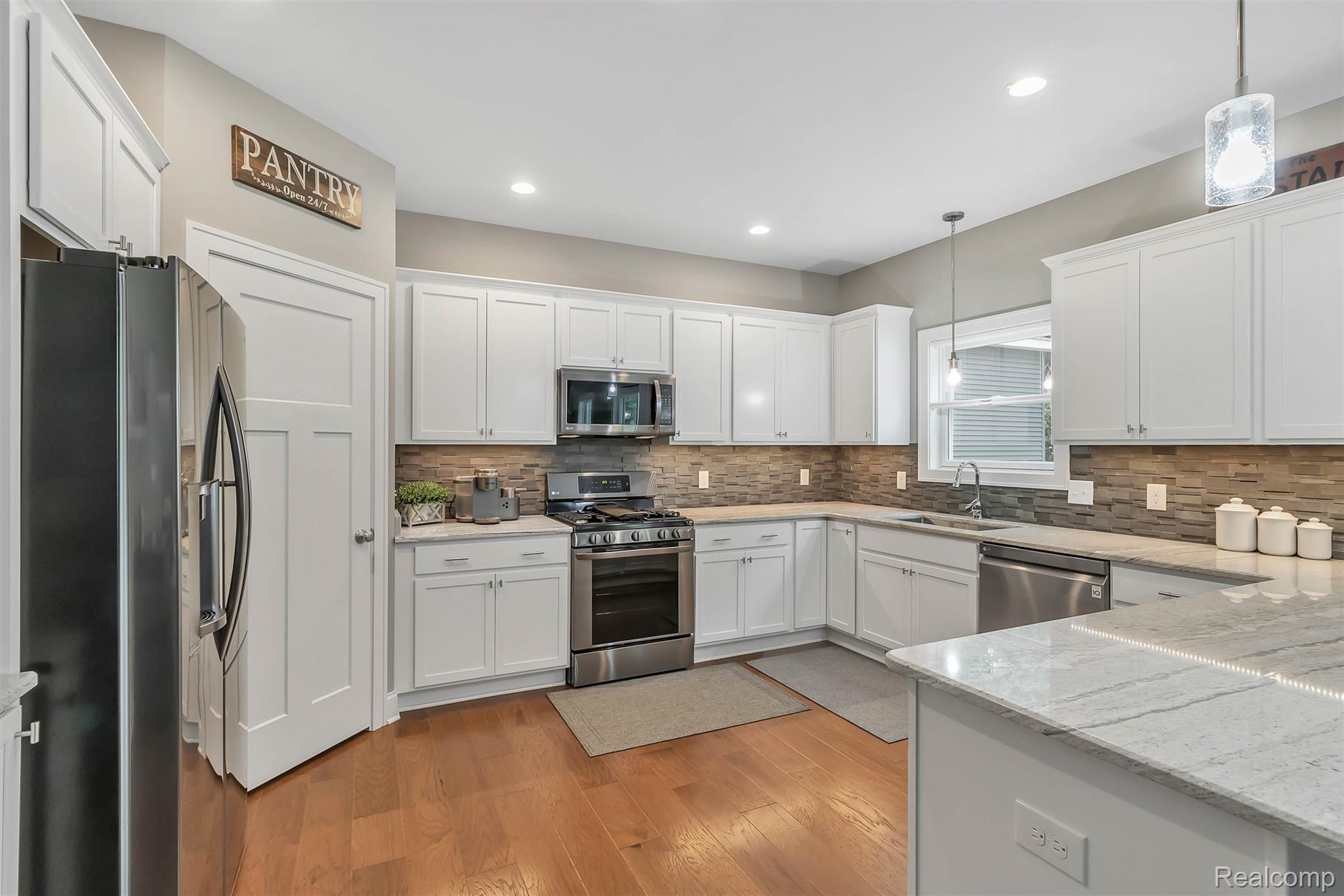 860 North Hacker Road Howell, MI 48843 - Photo 8 of 53 Spacious Kitchen, Hardwood Floors, Deep Sink