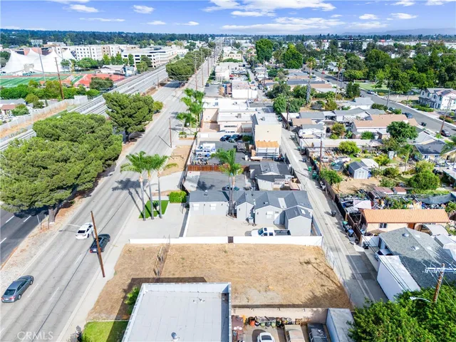 an aerial view of a house with a swimming pool