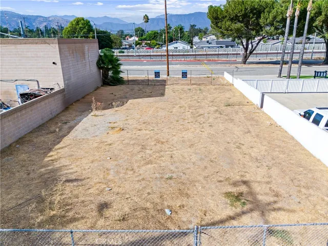 a view of swimming pool with outdoor seating and plants