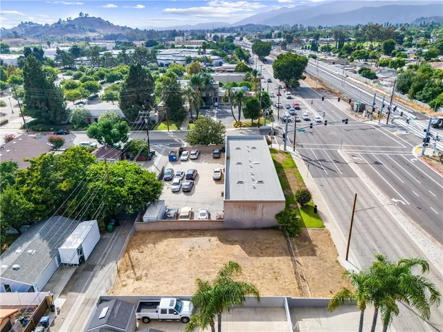 an aerial view of a house with a yard and lake view