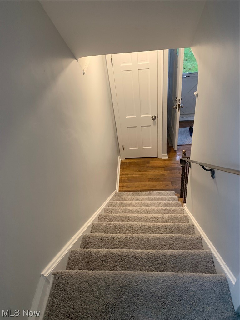 1456 Evanston Road Lyndhurst, OH 44124 - Photo 30 of 32 Stairs featuring dark wood-type flooring