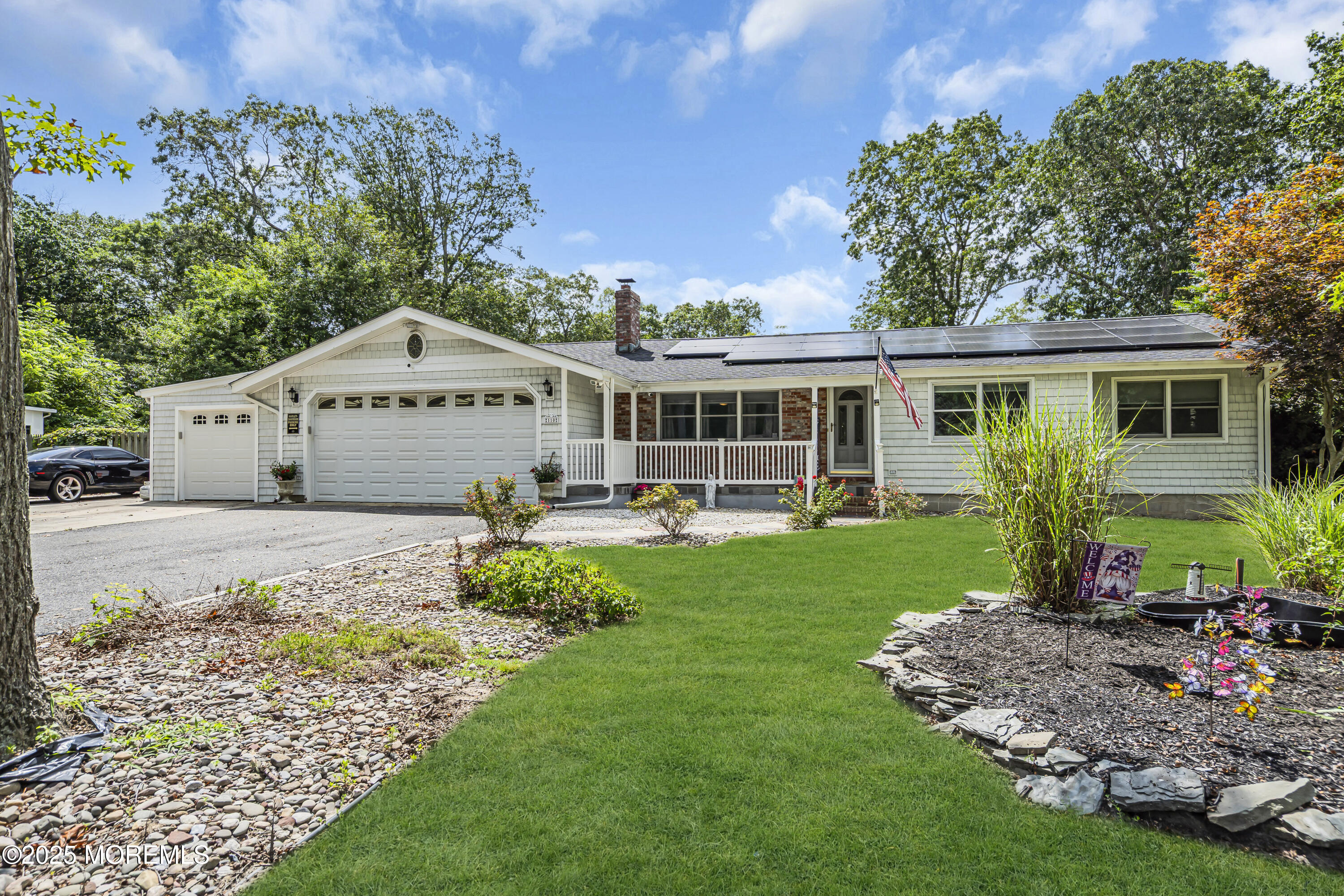 a front view of a house with garden