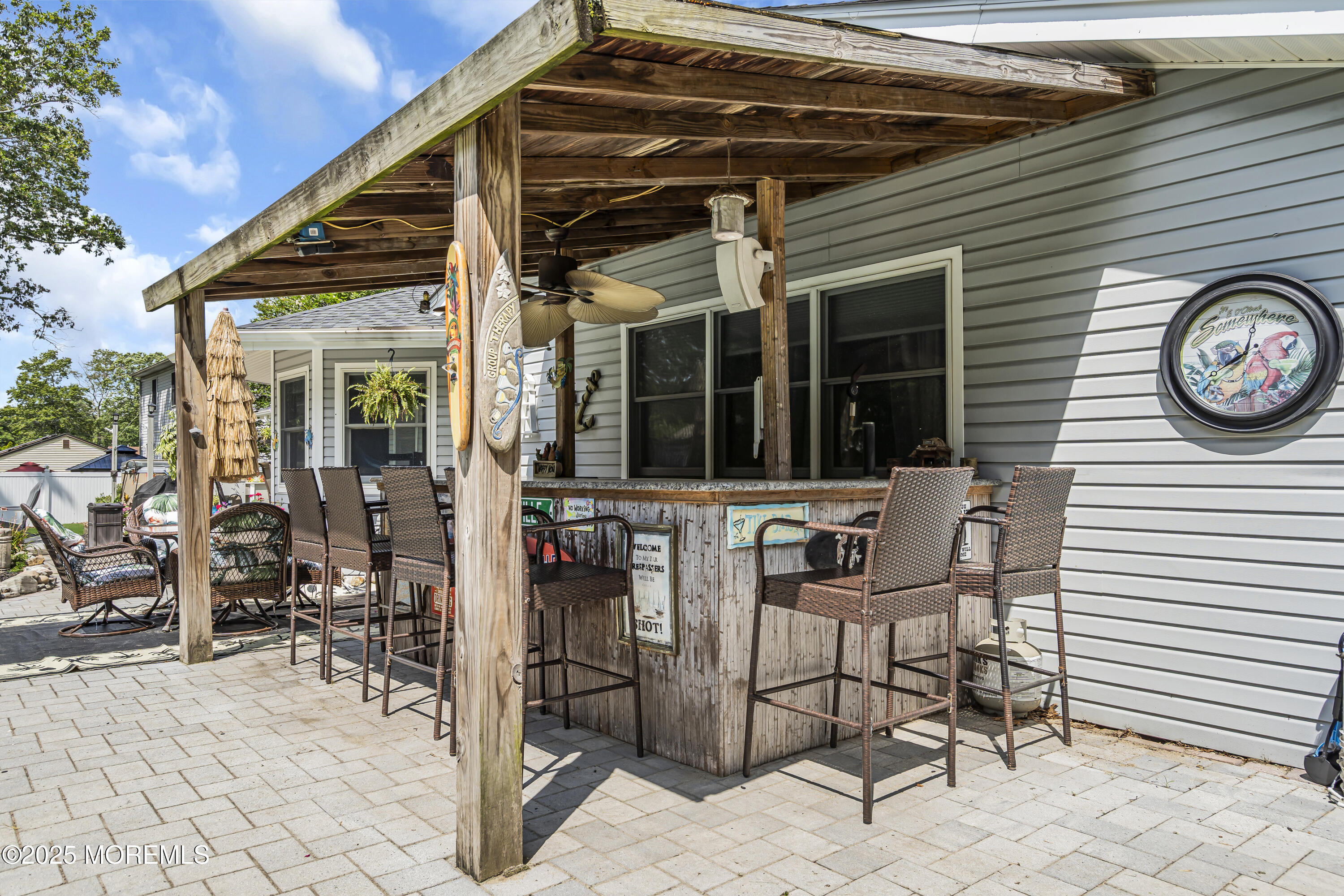 110 4th Avenue Tuckerton, NJ 08087 - Photo 32 of 38 a view of a patio with table and chairs and potted plants