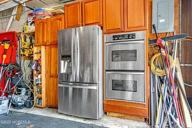 a view of a refrigerator with wooden floor