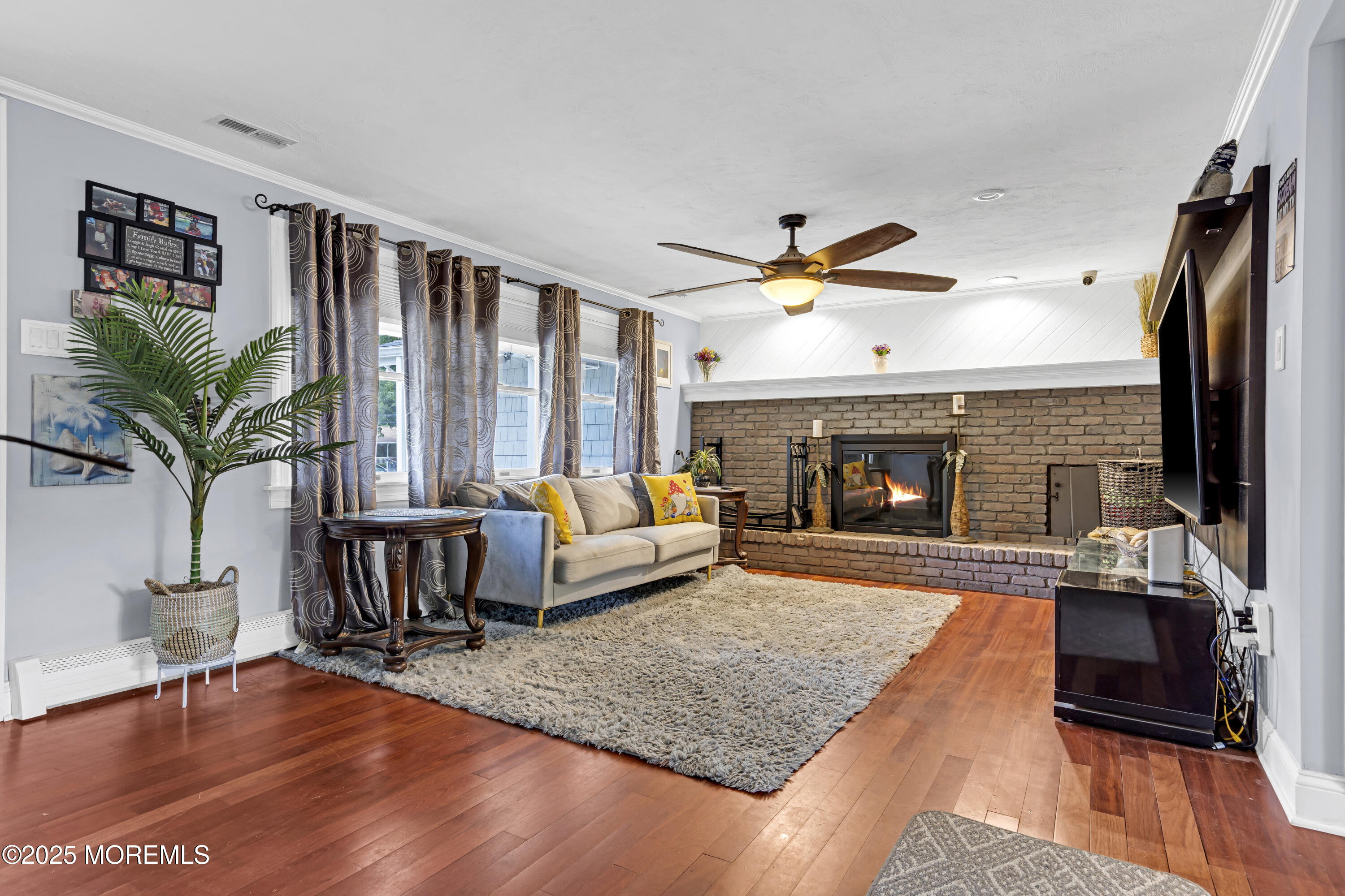 110 4th Avenue Tuckerton, NJ 08087 - Photo 5 of 38 a living room with furniture fireplace and flat screen tv