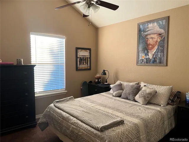a bedroom with bed and a window
