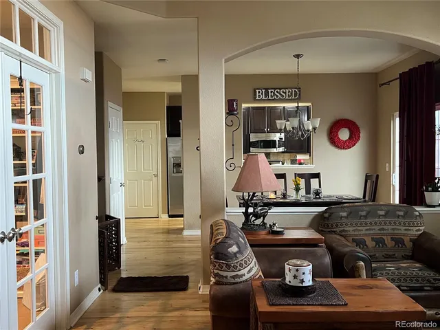 a living room with furniture and a window