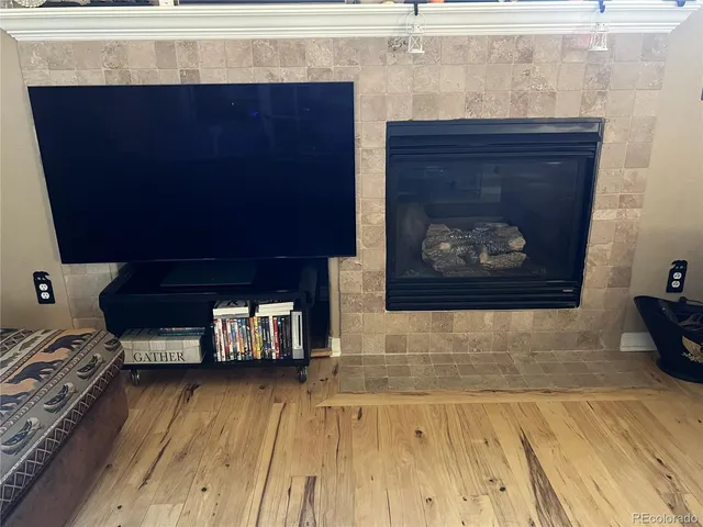 a wooden floor with a fireplace