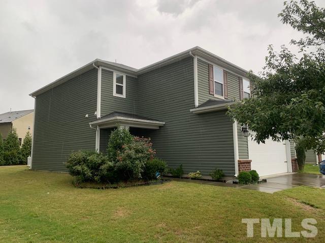 3558 Eastern Branch Road Raleigh, NC 27610 - Photo 2 of 25 a front view of a house with garden