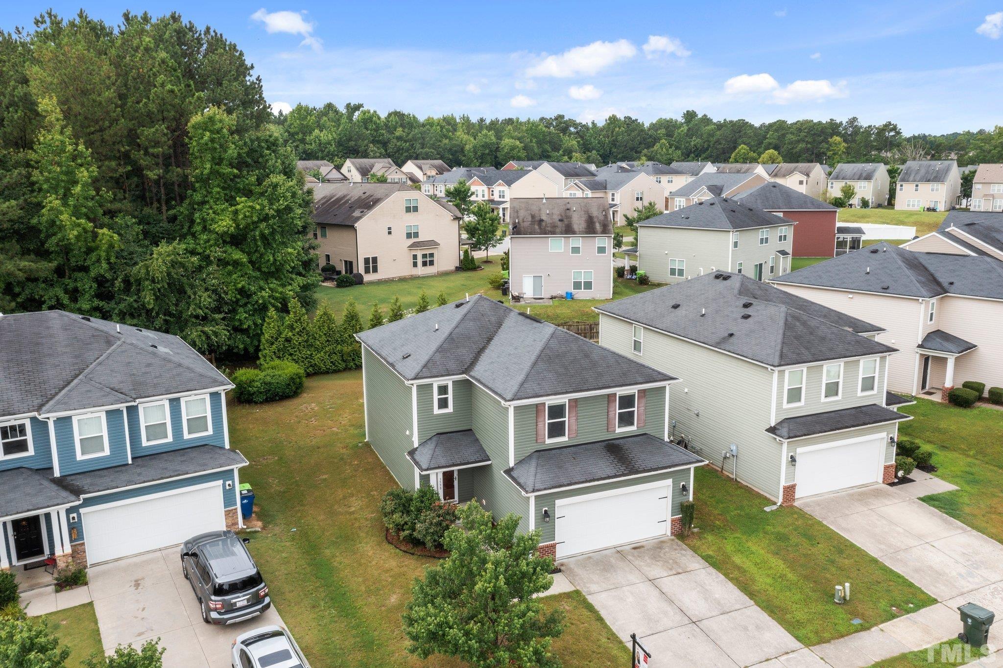 3558 Eastern Branch Road Raleigh, NC 27610 - Photo 9 of 25 an aerial view of a house with a garden