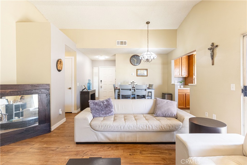 42015 Cosmic Drive Temecula, CA 92592 - Photo 12 of 27 a living room with furniture and a large window