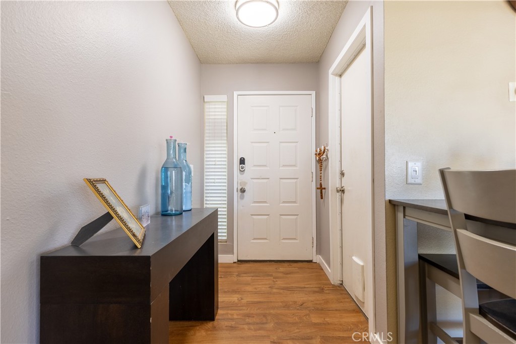 42015 Cosmic Drive Temecula, CA 92592 - Photo 4 of 27 a view of hallway with wooden floor