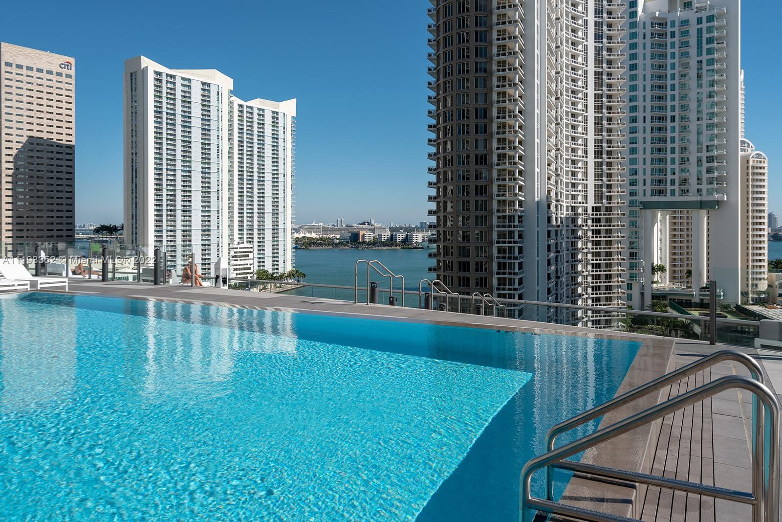 465 Brickell Avenue, Unit 2604 Miami, FL 33131 - Photo 17 of 23 a view of swimming pool with outdoor seating