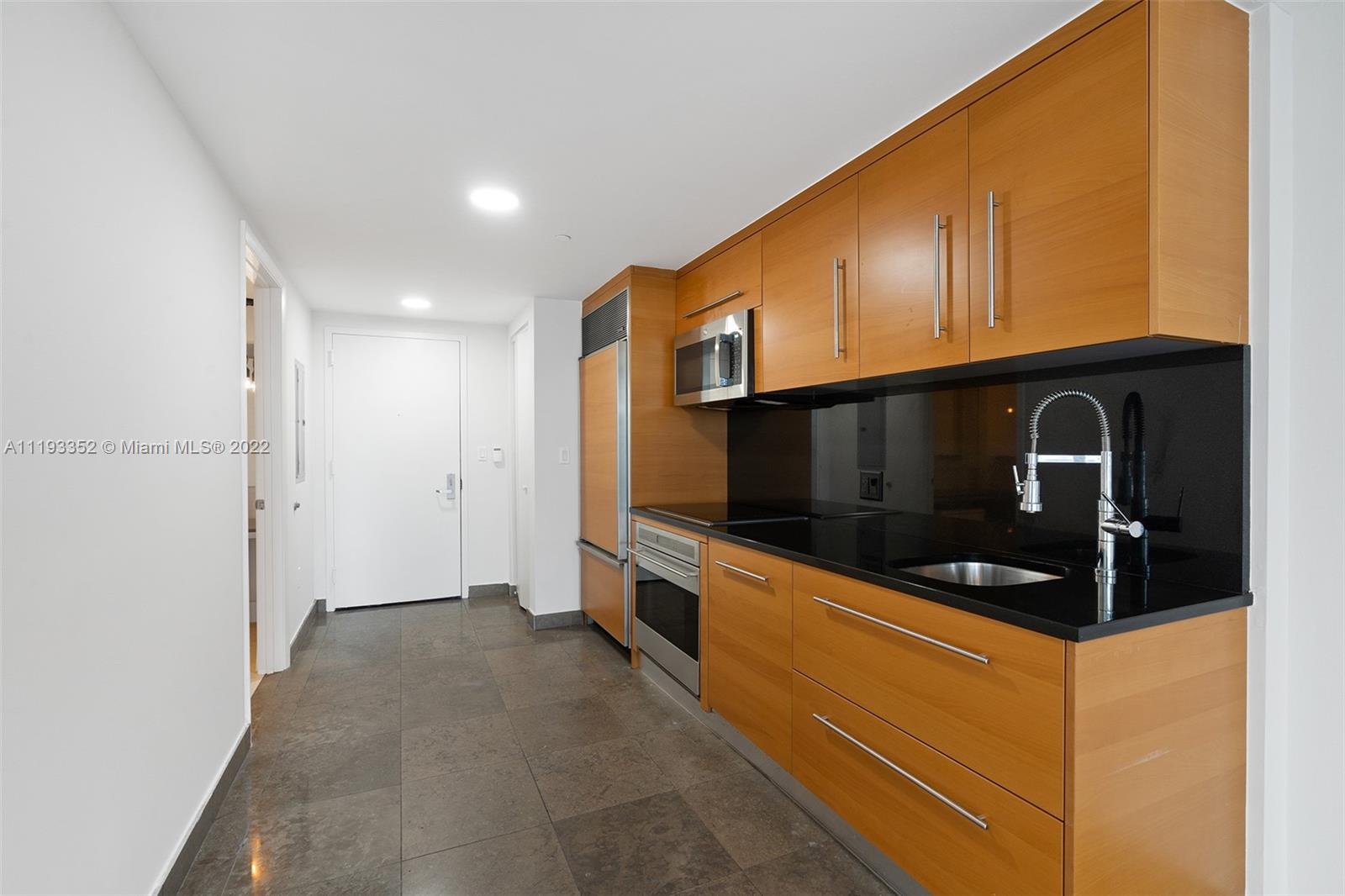 465 Brickell Avenue, Unit 2604 Miami, FL 33131 - Photo 6 of 23 a view of an oven and a refrigerator