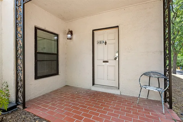a view of a door and chair in a room