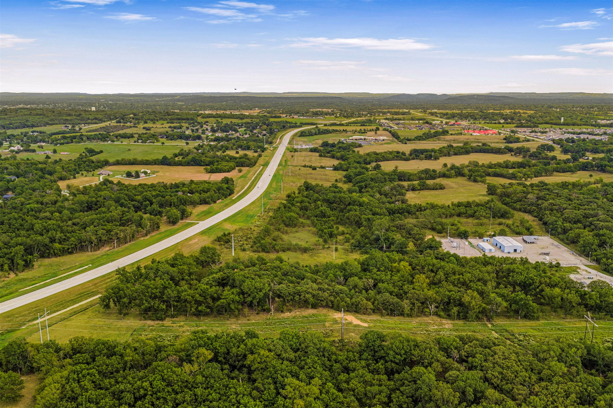 King Road Claremore, OK 74019 - Photo 18 of 45 Expansive land parcel with direct road frontage, surrounded by mature trees and open fields