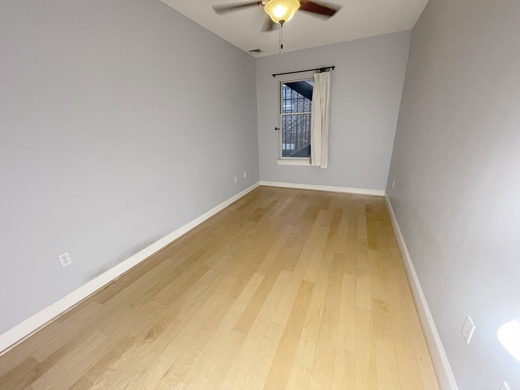 877 Harrison Avenue, Unit 6 Boston, MA 02118 - Photo 9 of 9 wooden floor in an empty room