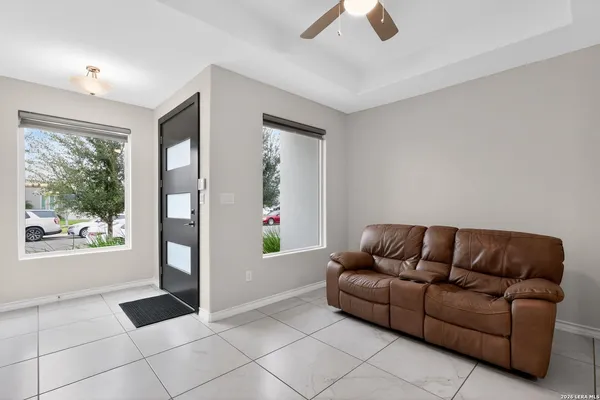 a living room with furniture and a window