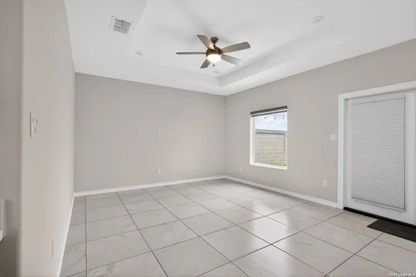 a view of an empty room with a window