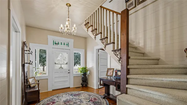 a view of entryway livingroom and hall