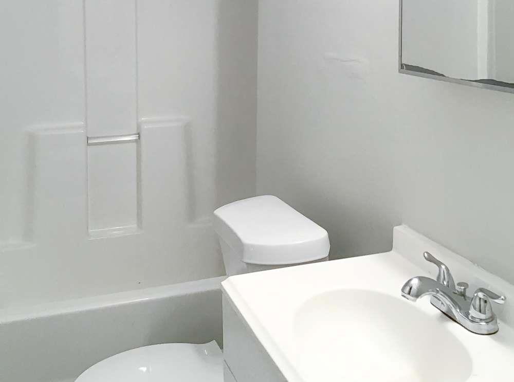 4666 Edwina Lane Southwest Atlanta, GA 30331 - Photo 11 of 15 a bathroom with a sink and a toilet