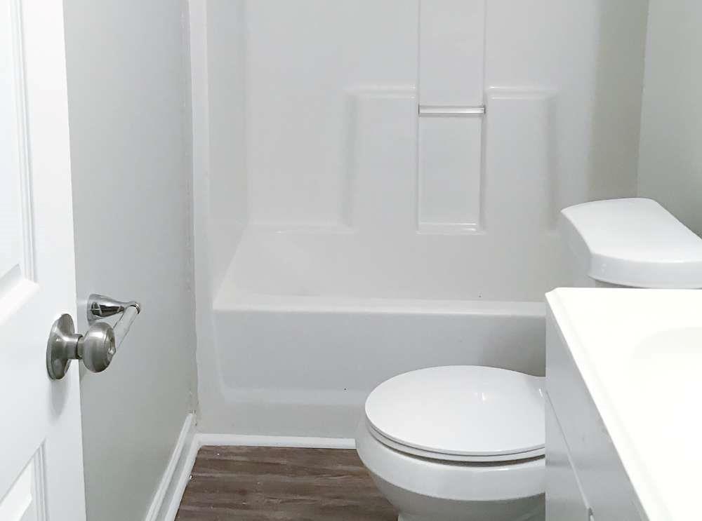 4666 Edwina Lane Southwest Atlanta, GA 30331 - Photo 12 of 15 a bathroom with a toilet and a shower