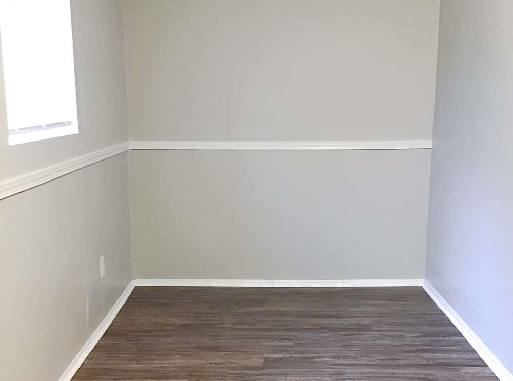4666 Edwina Lane Southwest Atlanta, GA 30331 - Photo 13 of 15 a view of an empty room with wooden floor and a window