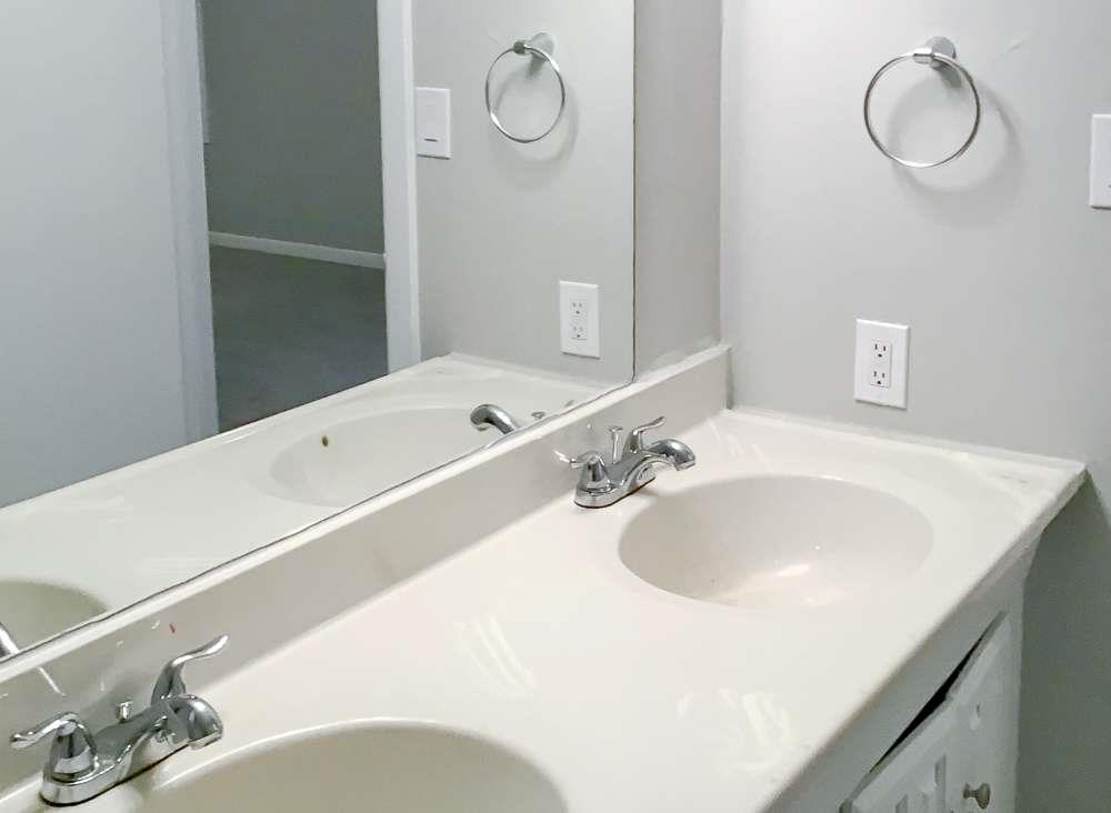4666 Edwina Lane Southwest Atlanta, GA 30331 - Photo 15 of 15 a bathroom with a sink and a mirror