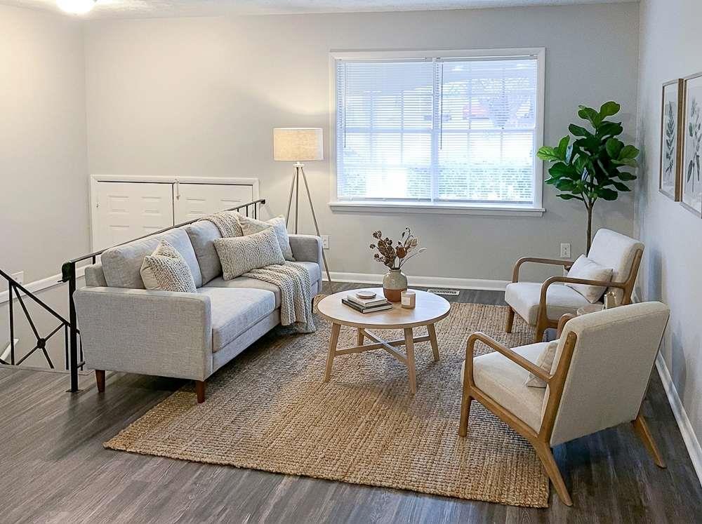 4666 Edwina Lane Southwest Atlanta, GA 30331 - Photo 5 of 15 a living room with furniture and a potted plant