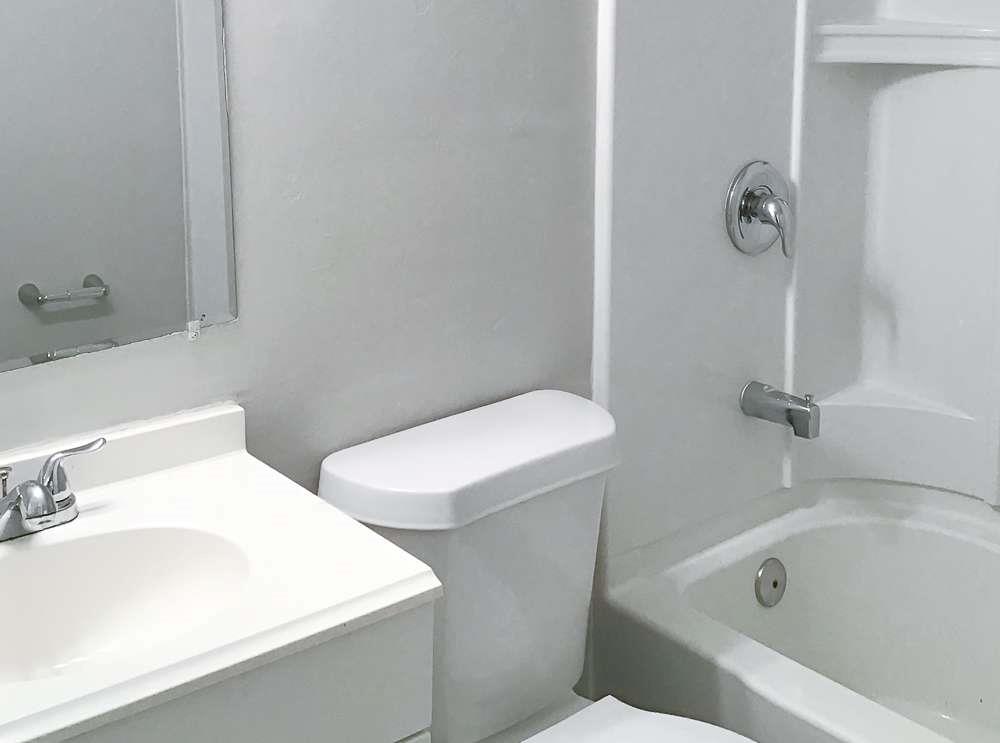 4666 Edwina Lane Southwest Atlanta, GA 30331 - Photo 6 of 15 a bathroom with a sink and a toilet