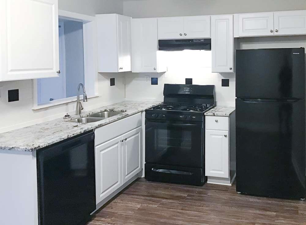 4666 Edwina Lane Southwest Atlanta, GA 30331 - Photo 7 of 15 a kitchen with a sink stove and refrigerator