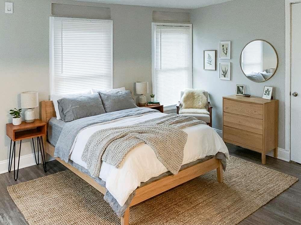 4666 Edwina Lane Southwest Atlanta, GA 30331 - Photo 10 of 15 a bedroom with a bed and a chandelier