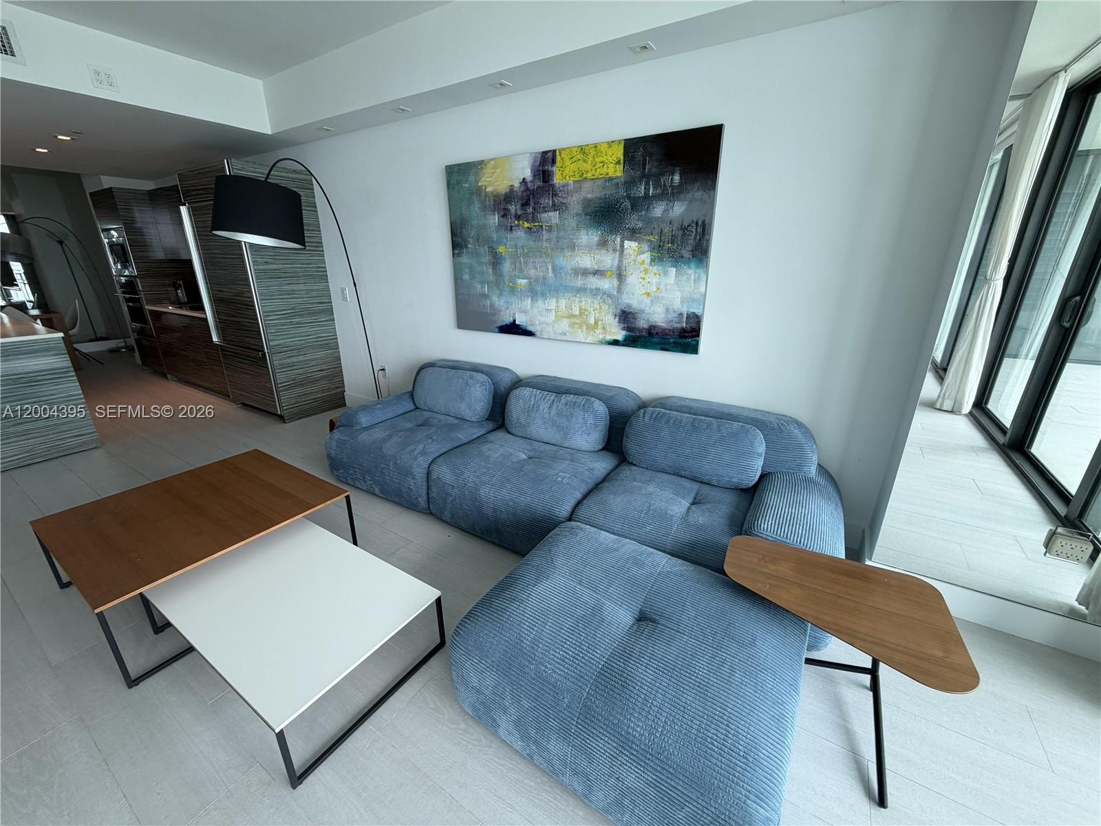 460 Northeast 28th Street, Unit 2806 Miami, FL 33137 - Photo 3 of 10 a living room with furniture and a window