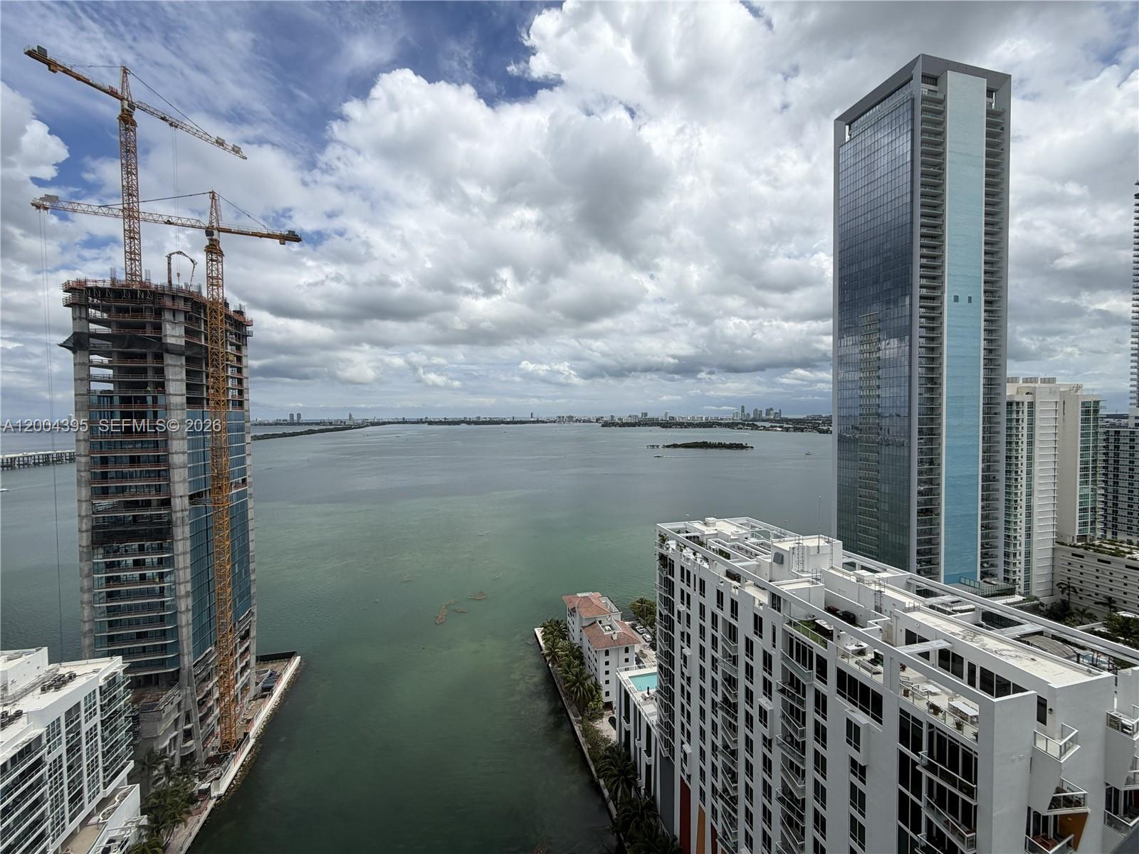 460 Northeast 28th Street, Unit 2806 Miami, FL 33137 - Photo 9 of 10 a balcony with table and chairs