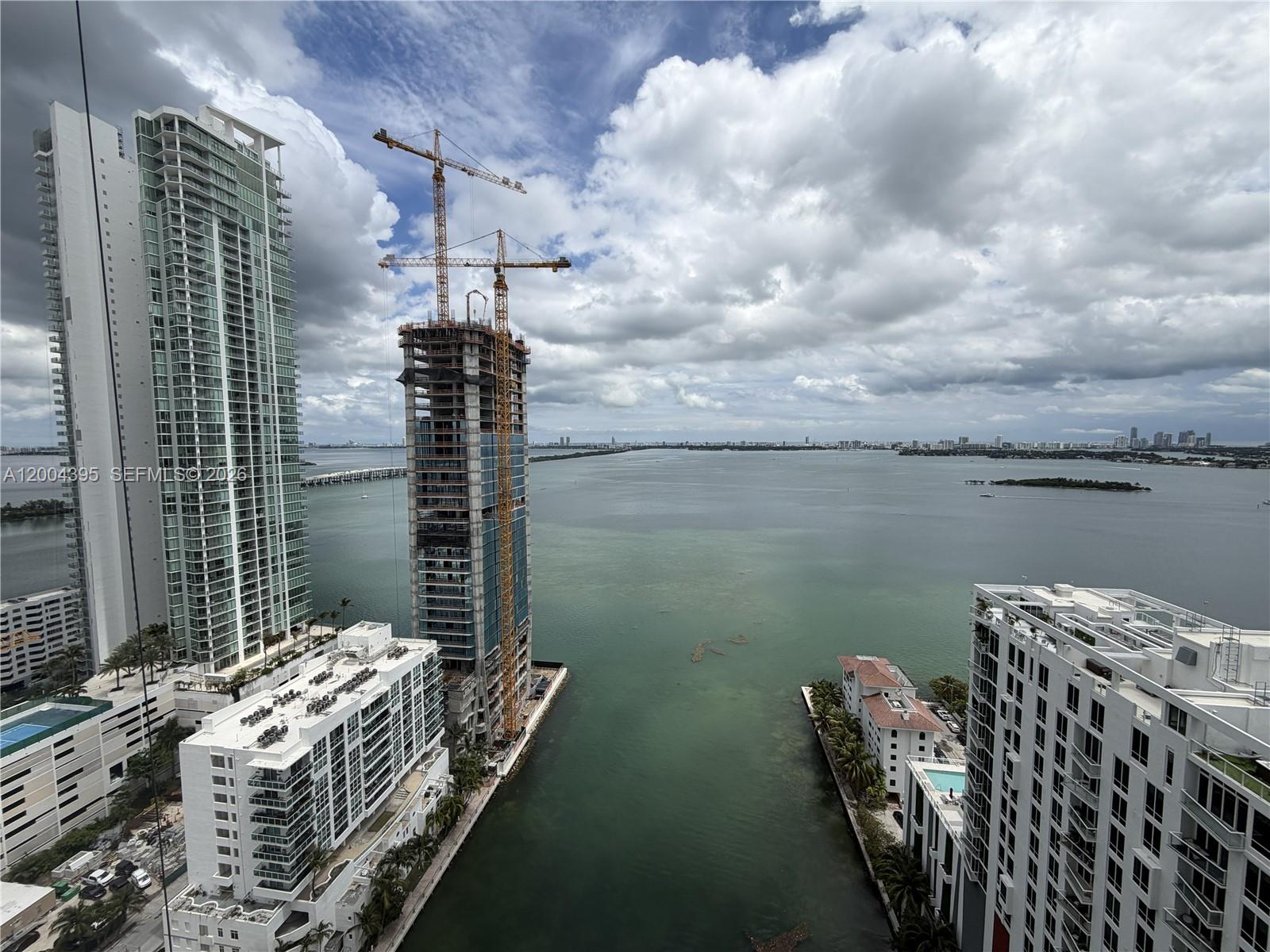 460 Northeast 28th Street, Unit 2806 Miami, FL 33137 - Photo 10 of 10 a balcony with chairs and wooden floor