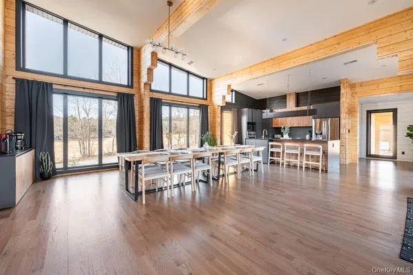 a view of a dining room with furniture window and wooden floor