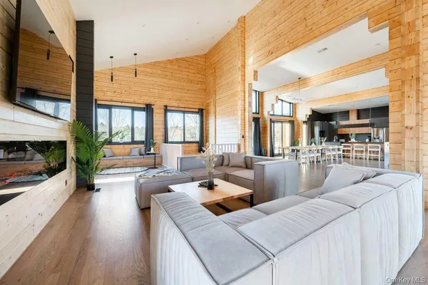 a living room with fireplace furniture and a flat screen tv