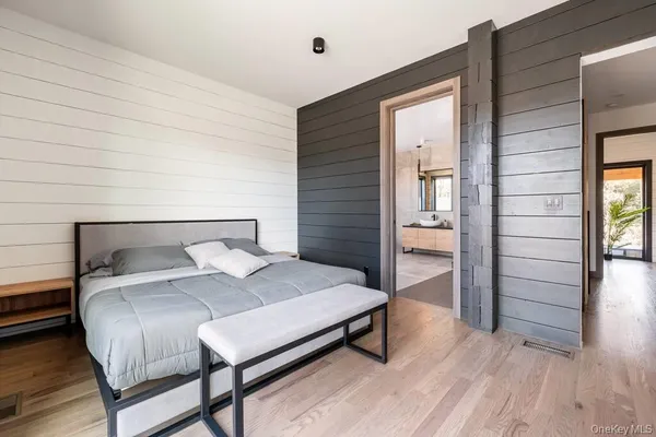 a bathroom with double vanity and a shower