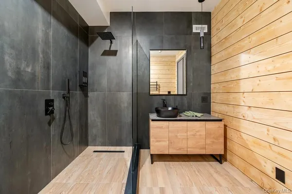 a large spacious bathroom with a bathtub and sink