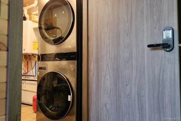 a roof deck with a table and chairs