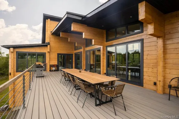 a outdoor space with patio the chairs and a potted plant