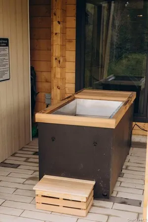 a picture of a bathroom with a shower