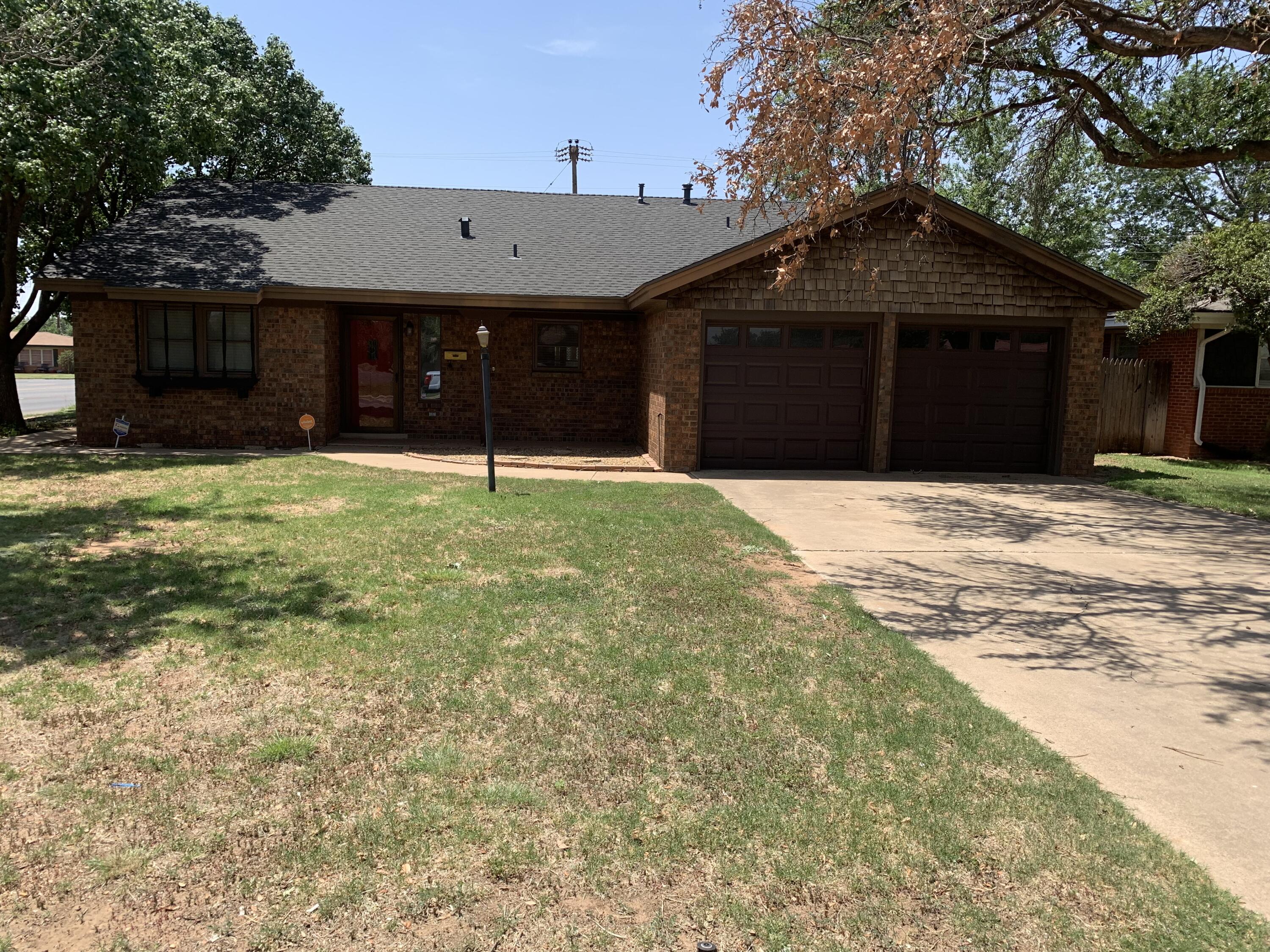 5201 15th Street Lubbock, TX 79416 - Photo 2 of 16 a house with yard in front of it