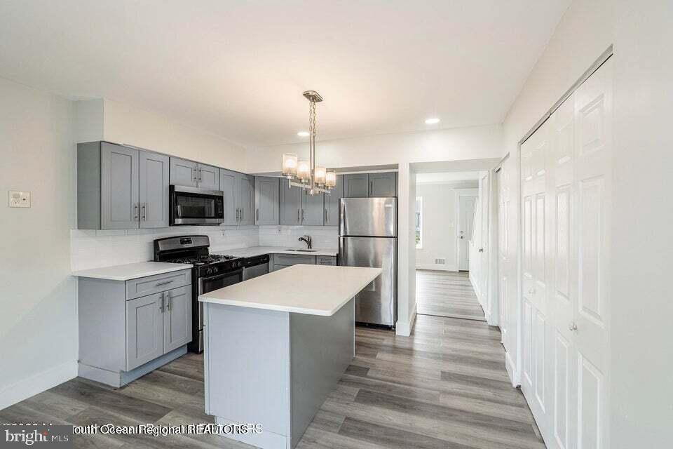19 Creek Road Brick, NJ 08724 - Photo 2 of 10 a kitchen with stainless steel appliances a refrigerator sink and microwave