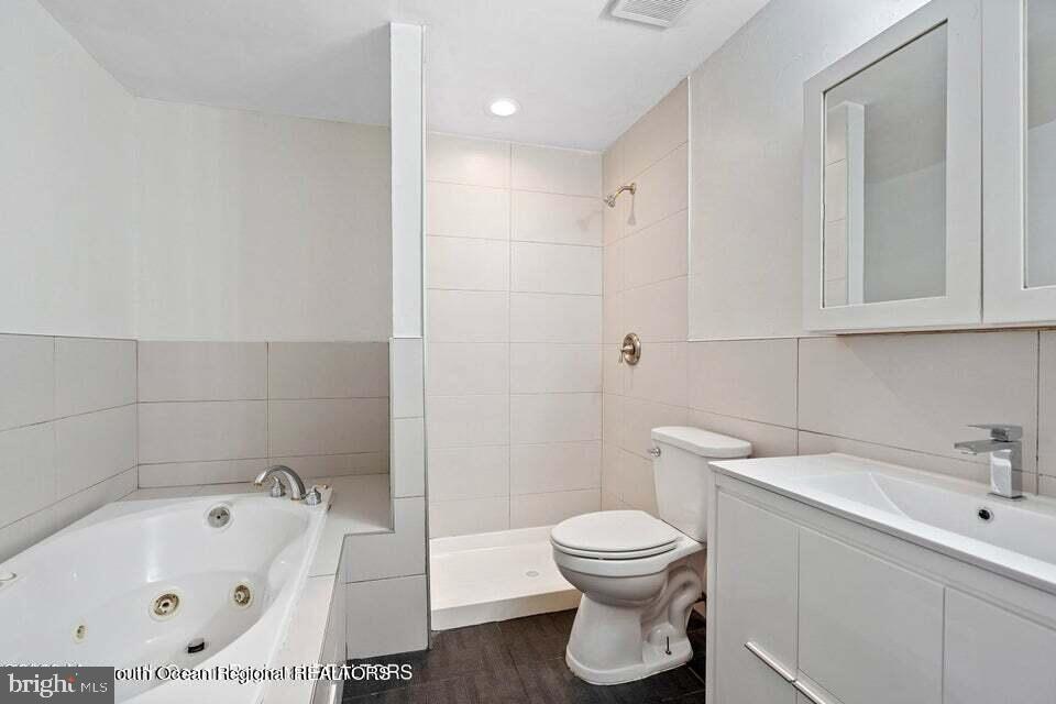 19 Creek Road Brick, NJ 08724 - Photo 8 of 10 a bathroom with a toilet and a sink