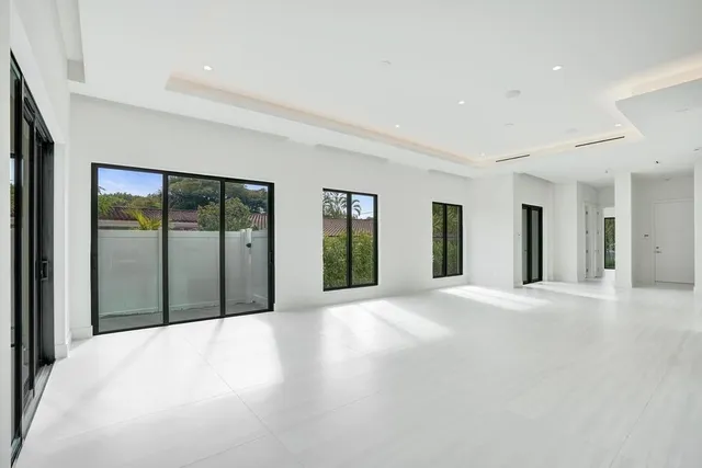 a bathroom with double sink and a mirror