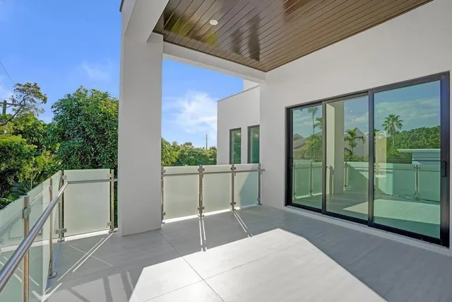 an entryway with wooden floor