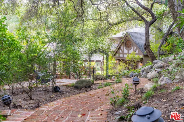 an empty room with furniture fireplace and window