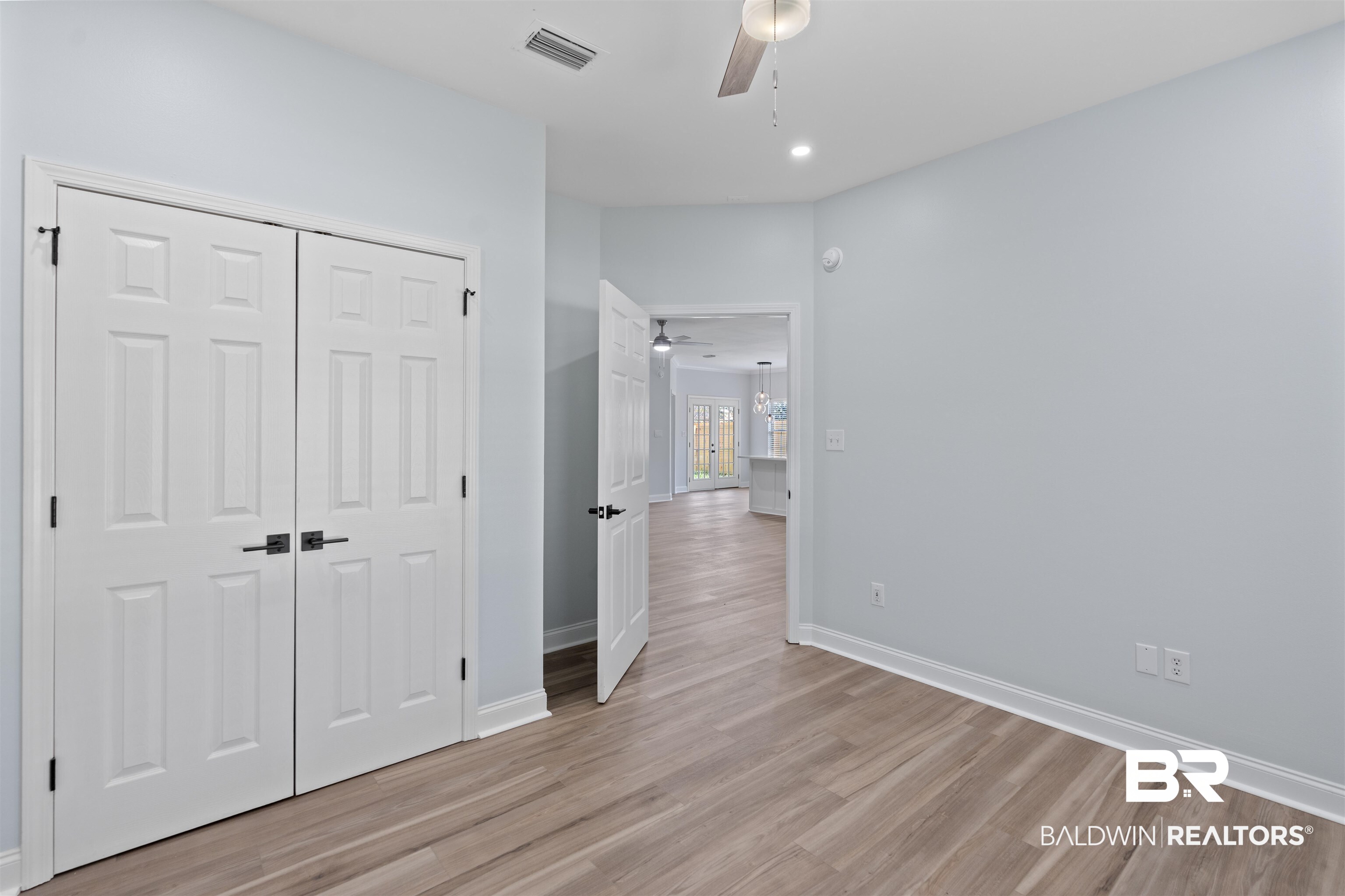 14947 Silveroaks Loop Silverhill, AL 36576 - Photo 21 of 24 Unfurnished bedroom with light wood-style floors, a closet, ceiling fan, and recessed lighting